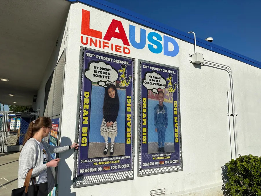 Two Dream Big student banners printed in-house hanging outside an LA Unified school